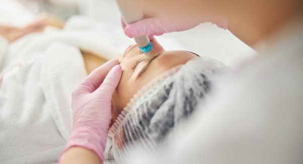 Young Caucasian female undergoing a dermatological procedure